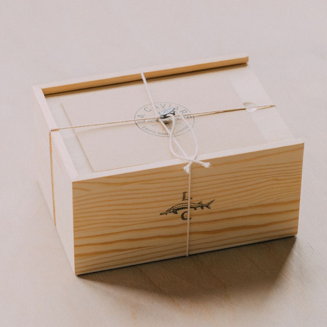 Wooden La Caviare luxury gift box with caviar in it
